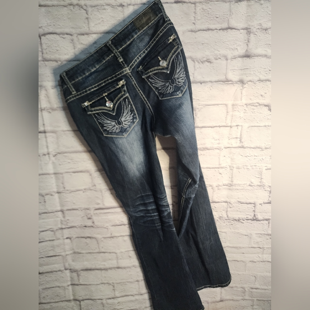 ZCO Boot Cut Jeans dark blue Distressed jeans. Size 9 wing pocket embroidery.